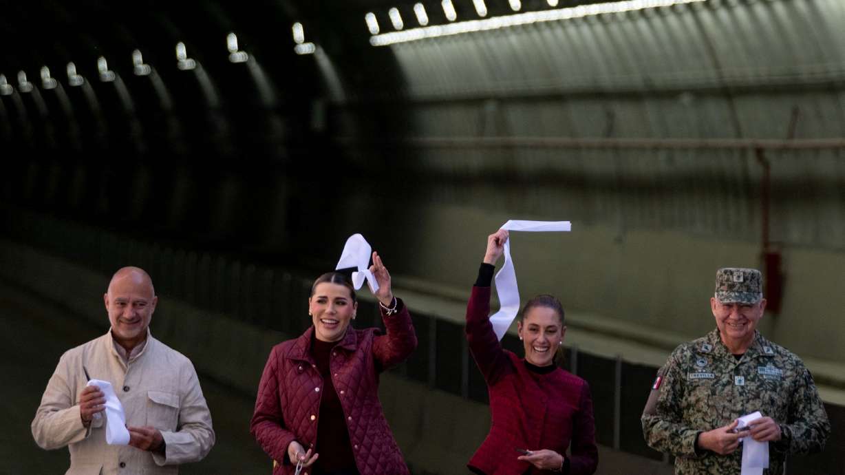 Mexico's President Claudia Sheinbaum, center right, waves a ribbon next to Baja California Governor Marina del Pilar Avila Olmeda on January 30.