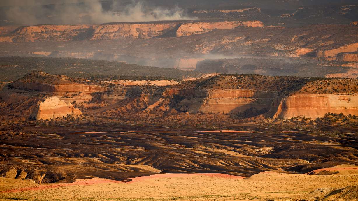 Smoke rises from the Snyder Fire burning near Thompson Springs, in eastern Utah, on June 28.