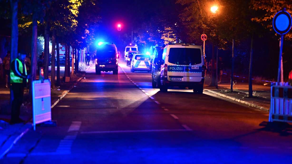 Police officers are on the scene following the cancellation of Christopher Street Day in Berlin, on Saturday. Several people were injured after a car drove into the crowd.