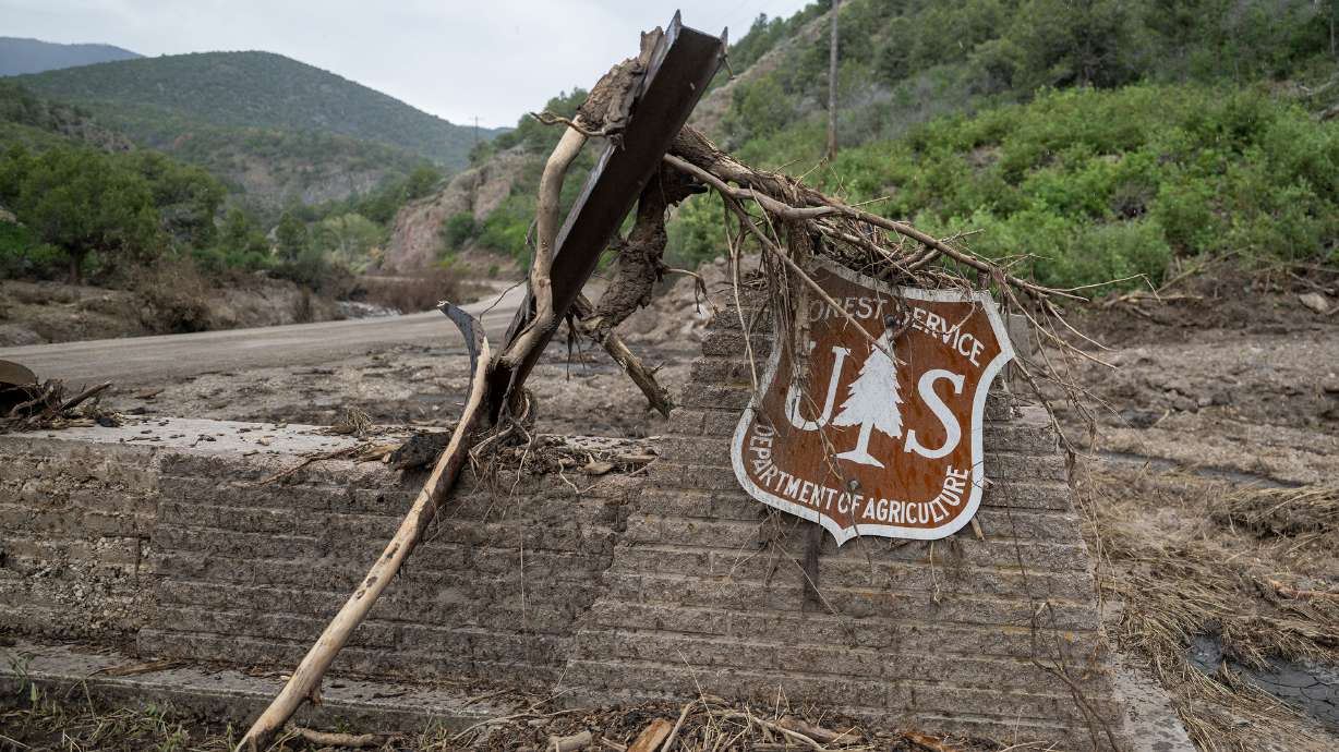 Remnants of a U.S. Forest Service sign just off the road in Beaver Canyon are pictured on July 24. Utah and federal officials announced an $18 million agreement to begin the recovery from the fire and flooding in the area, while firefighting operations continue at the Widemouth 2 Fire also at Fishlake National Forest.