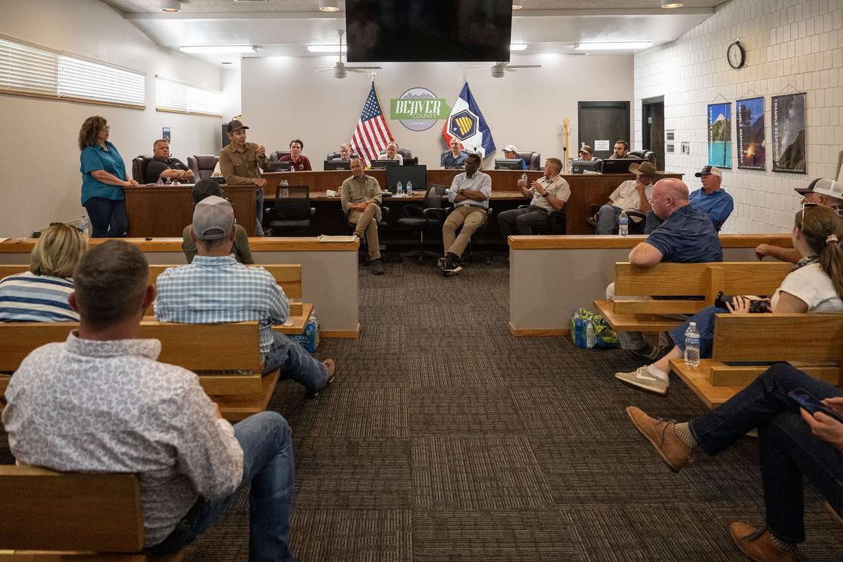 Members of Congress and federal, state, and local officials gather to talk with concerned cattleman in Beaver on Friday. Much of the discussion surrounded better forest management.