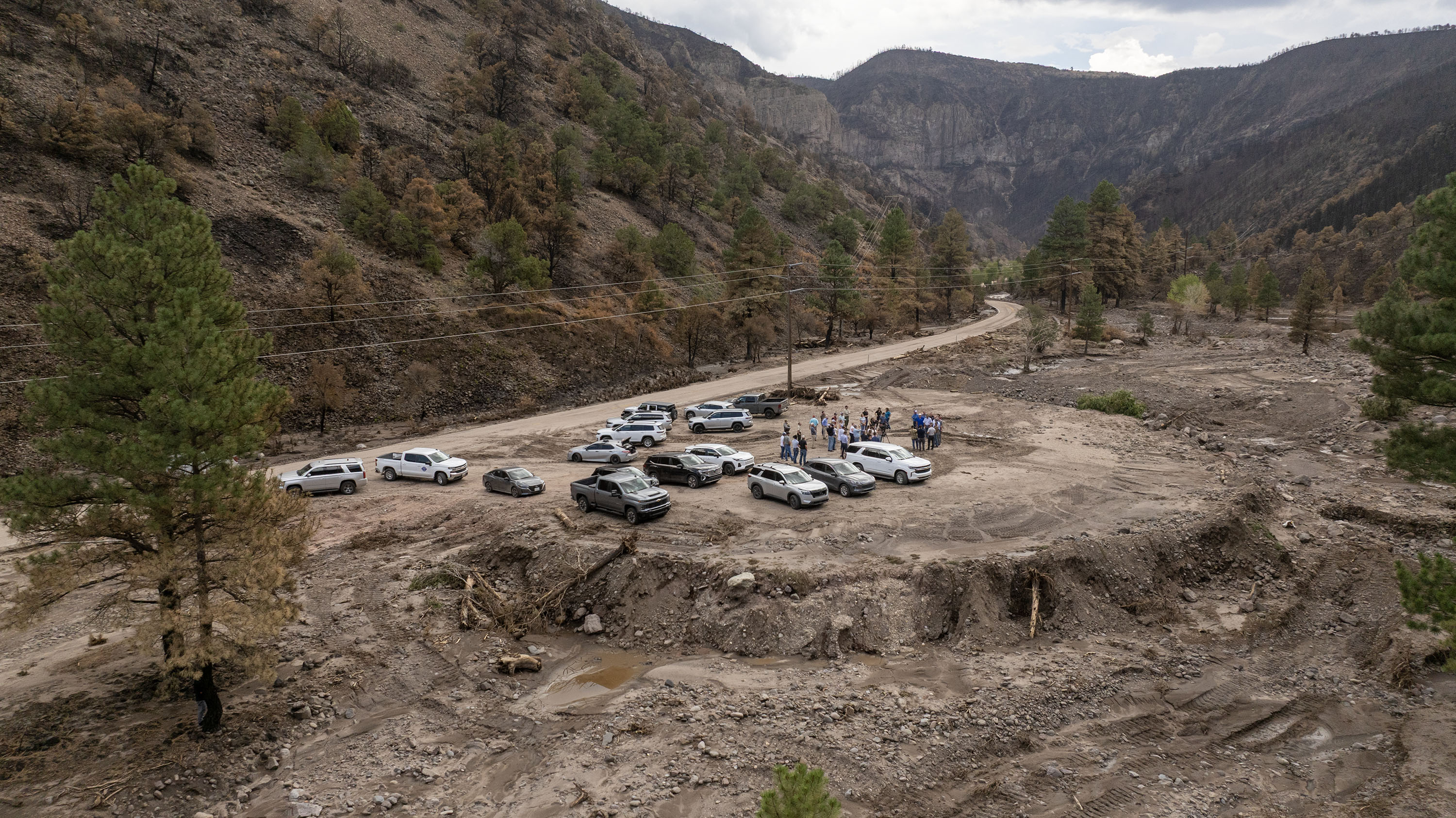 Members of Congress and federal, state, and local officials visited the Cottonwood Fire burn scar in the Fishlake National Forest, Friday. The double disaster has renewed questions about forest management.