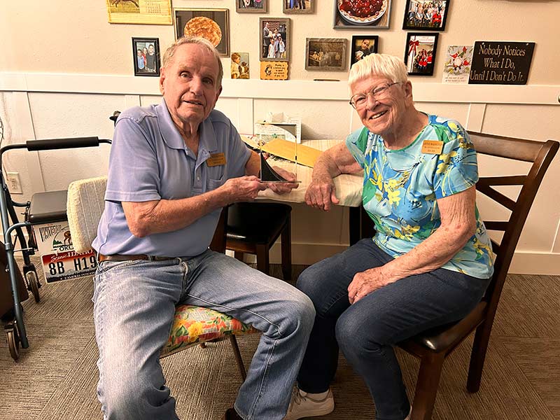 Jack Magnusson and his wife, Lavine, pose for a photo inside their Lincoln Court apartment in Idaho Falls, Tuesday. Magnusson reflected on Scotty's Drive In and how it remains an icon over 60 years later.