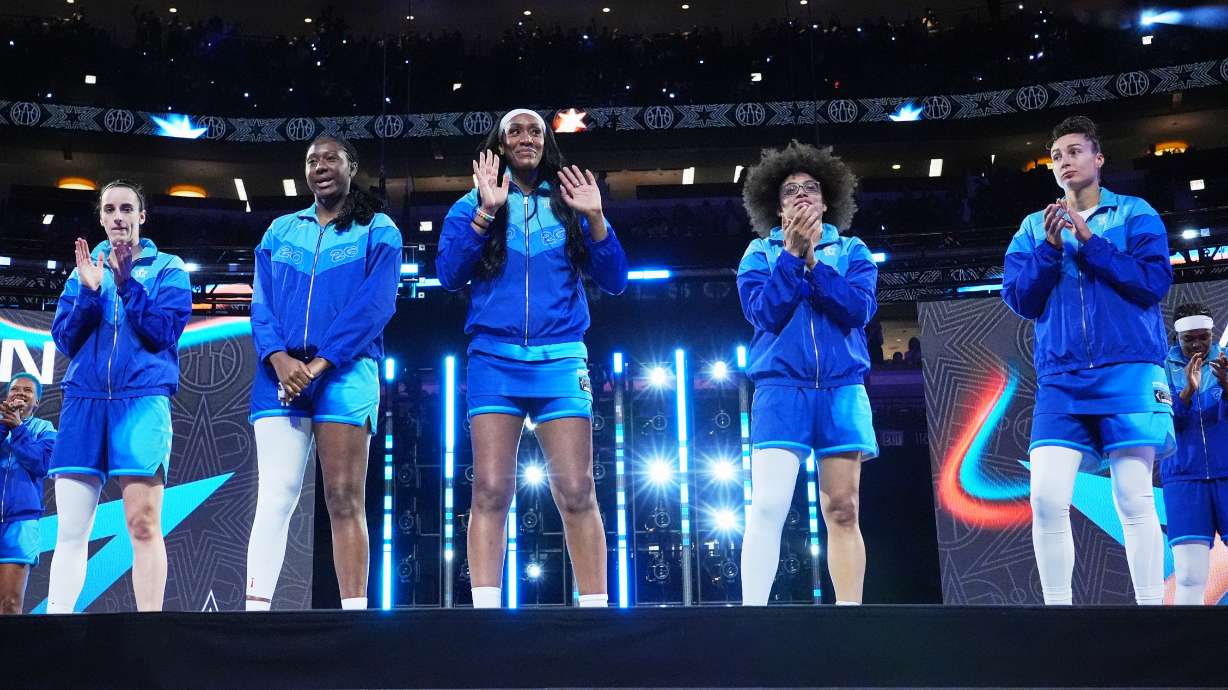 Left to right; Team Spoon's Caitlin Clark, Aliyah Boston, A'Ja Wilson, Olivia Miles and Jessica Shepard greet fans before a WNBA All-Star basketball game against Team Coop in Chicago, Saturday, July 25, 2026.