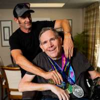Dynamic duo: Man with MS does marathons with a push from his brother