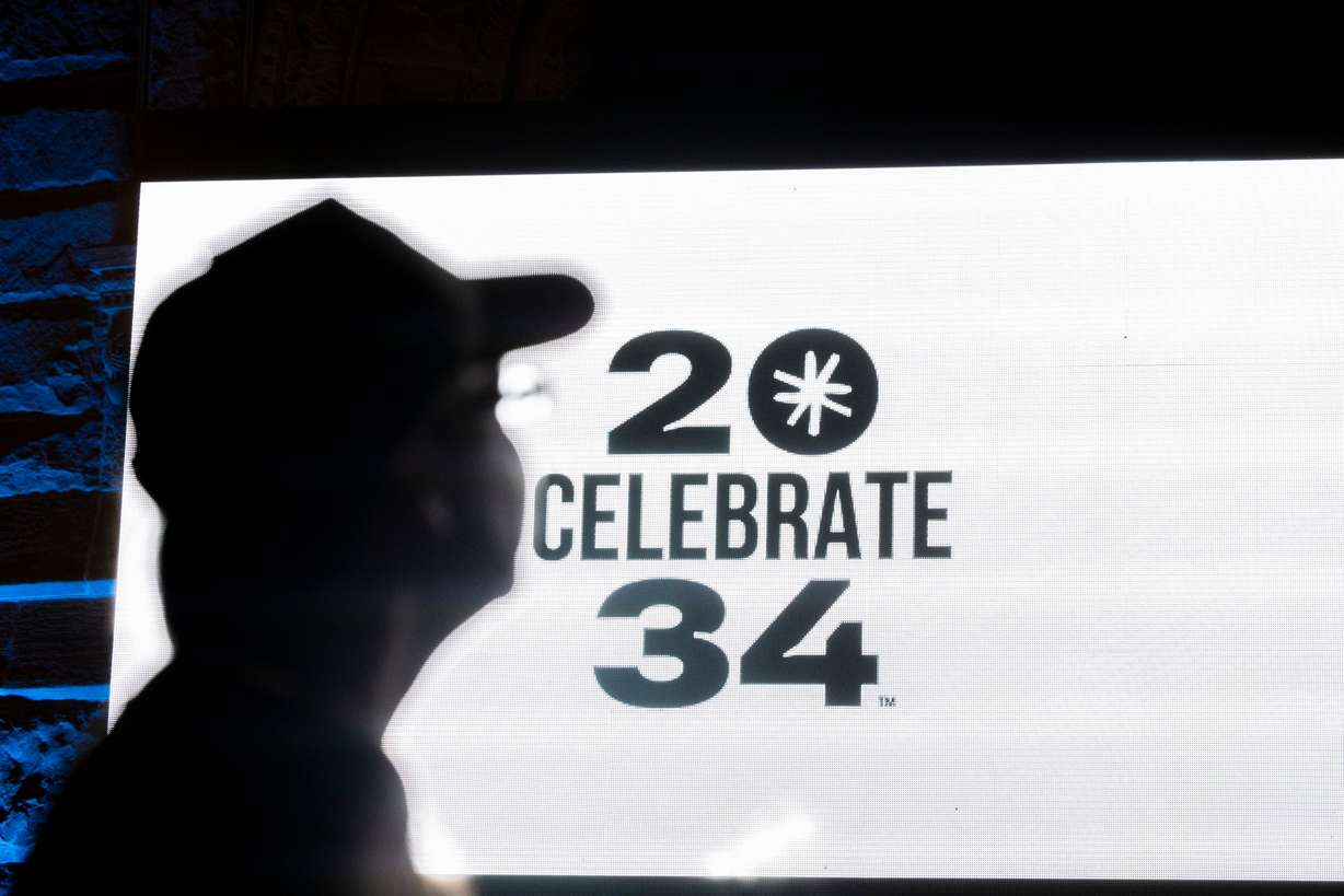 Jen Ahana, of Park City, looks to a screen before a live watch party for the Salt Lake City-Utah Committee’s 2034 Winter Olympics bid held at the Salt Lake City and County Building in Washington Square Park on July 24, 2024. There are still concerns about ticket prices for the Games.