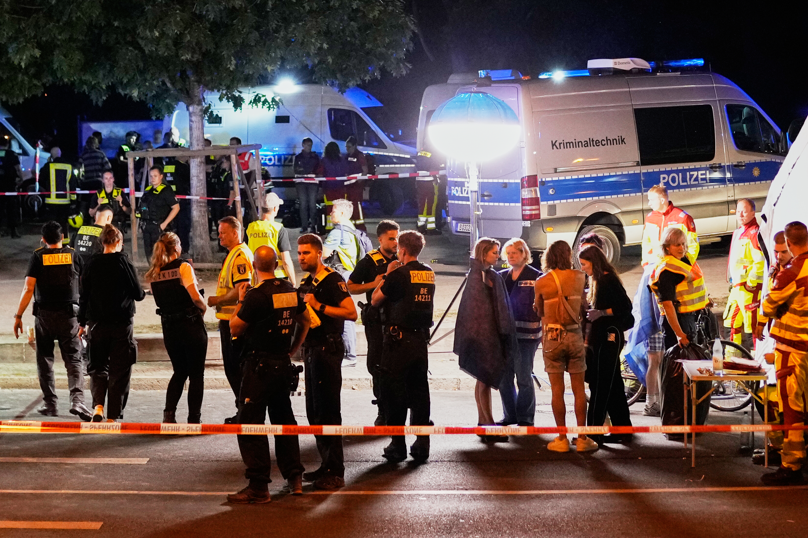 Emergency personnel and police gather in Berlin, early Sunday following the cancellation of Christopher Street Day festivities.