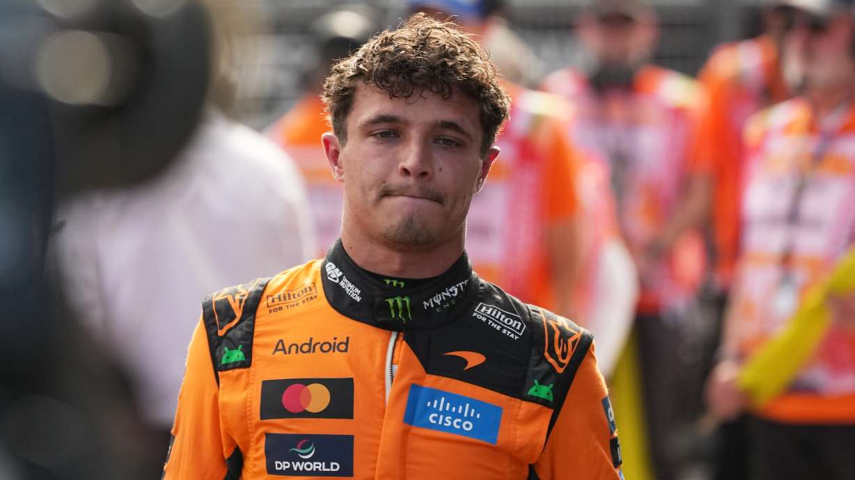 McLaren driver Lando Norris of Britain walks after winning the qualifying session ahead of Sunday's Formula One Hungarian Grand Prix auto race, at the Hungaroring racetrack in Mogyorod, near Budapest, Hungary, Saturday, July 25, 2026.
