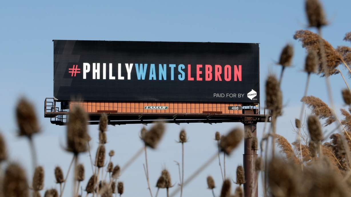 FILE - One of three billboards trying to entice Cleveland Cavaliers' LeBron James to come to Philadelphia are shown near a highway, Tuesday, Feb. 27, 2018, in Cleveland.