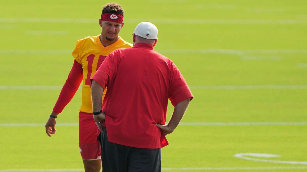 Kansas City Chiefs quarterback Patrick Mahomes talks with head coach Andy Reid at NFL football training camp Saturday, July 25, 2026, in St. Joseph, Mo.