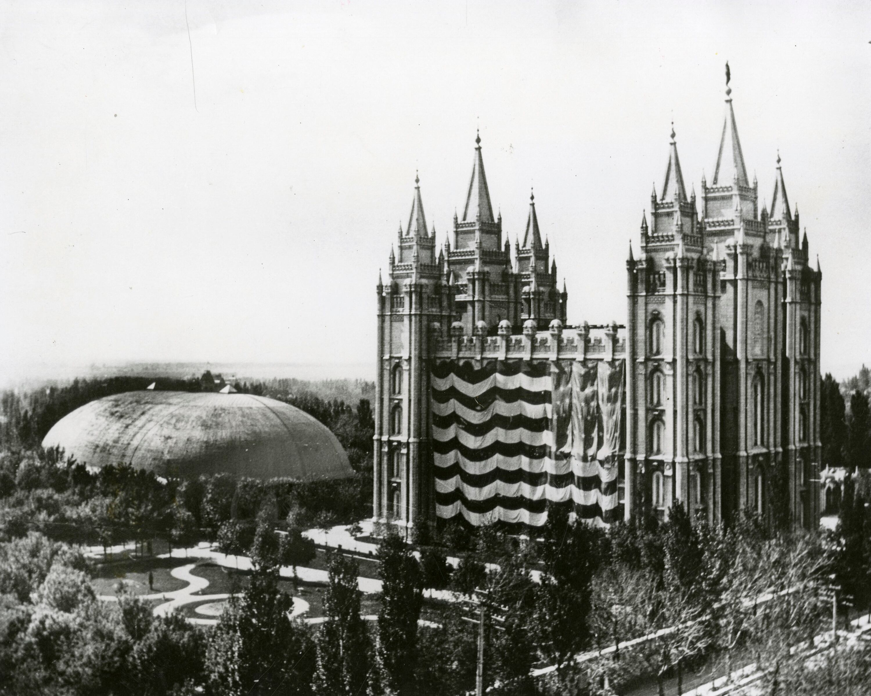 An American flag covers most of the Salt Lake Temple on Saturday, July 24, 1897, the 50th anniversary of the arrival of the pioneers in Salt Lake City.