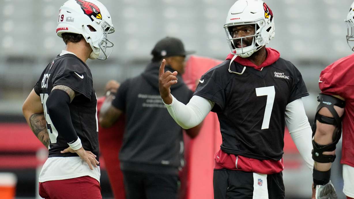 Arizona Cardinals quarterback Jacoby Brissett (7) talks with Cardinals quarterback Carson Beck, left, during NFL football training camp practice, Thursday, July 23, 2026, in Glendale, Ariz.