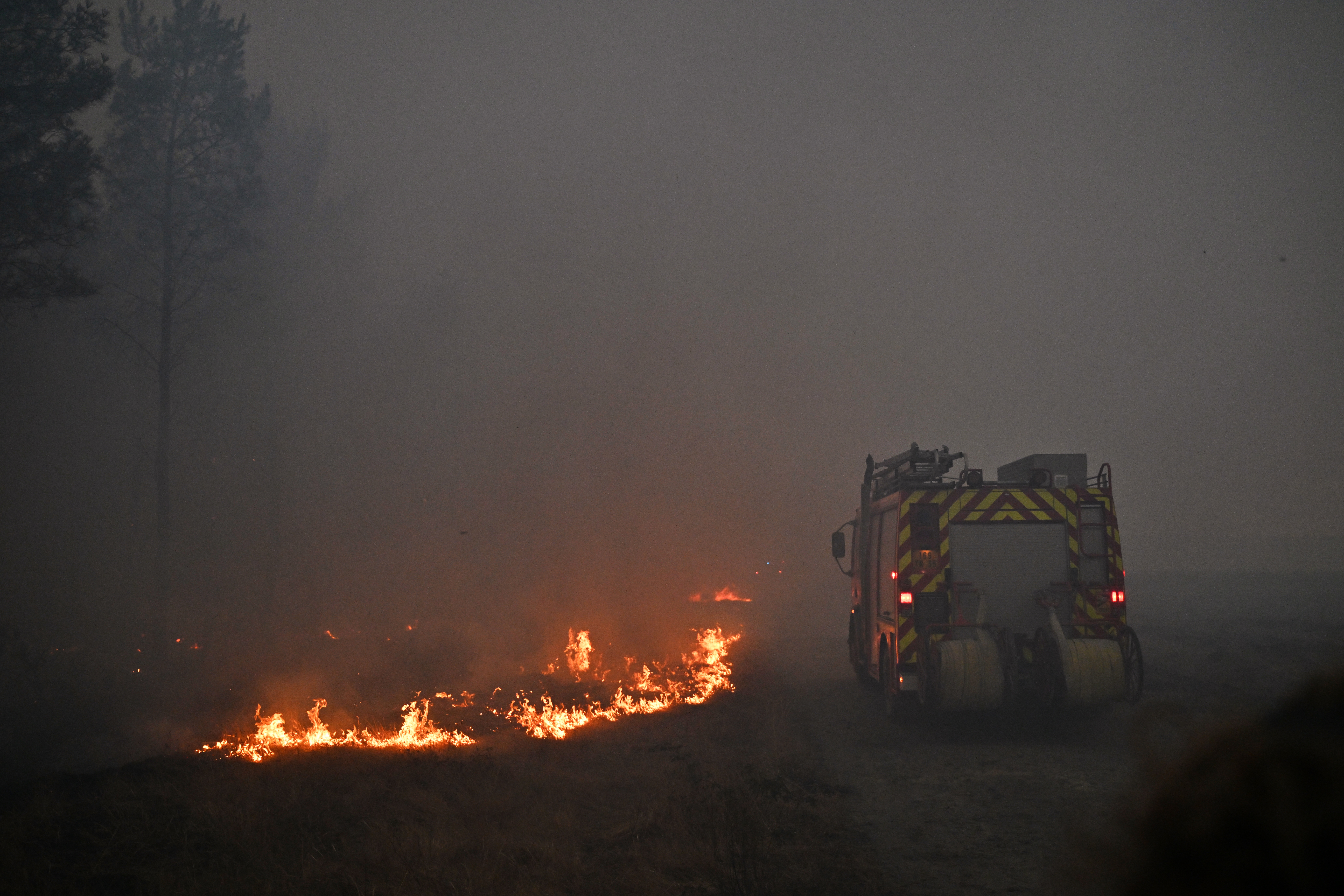 France says monster fire that forced 220,000 people to flee has stopped growing