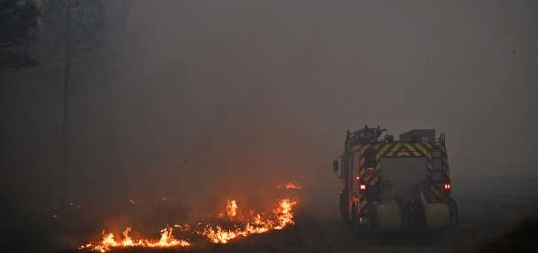 France says monster fire that forced 220,000 people to flee has stopped growing