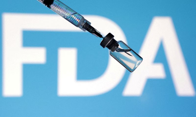 FILE PHOTO: A U.S. Food and Drug Administration (FDA) logo, a syringe and a vial are seen in this illustration taken May 13, 2025.