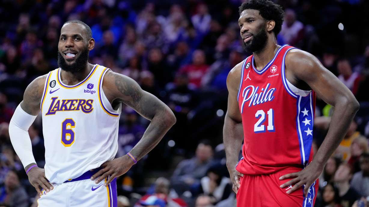 Los Angeles Lakers' LeBron James and Philadelphia 76ers' Joel Embiid play during an NBA basketball game, Friday, Dec. 9, 2022, in Philadelphia.