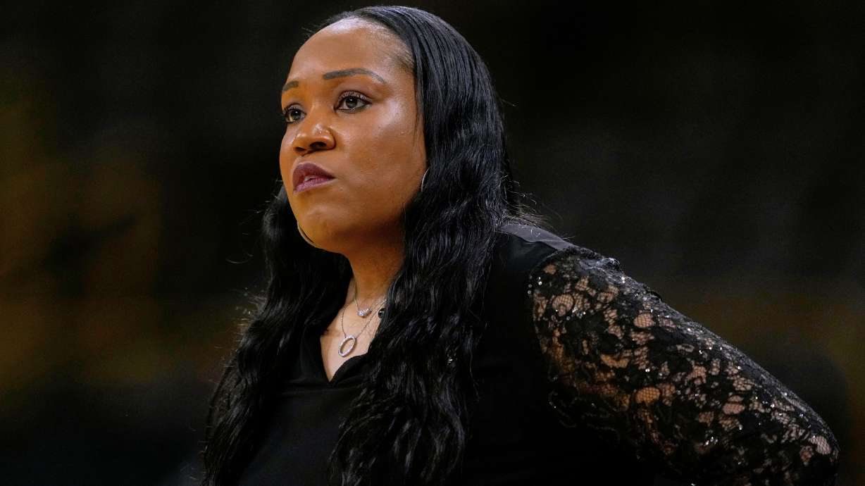 FILE - Virginia head coach Amaka Agugua-Hamilton watches from the bench during the first half in a First Four college basketball game against Arizona State in the NCAA Tournament, March 19, 2026, in Iowa City, Iowa.