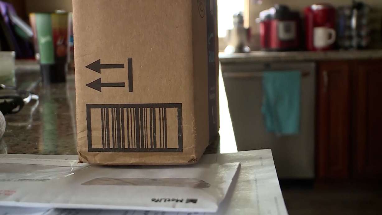 A package sits ready for shipment. Reshipping scams recruit victims to receive merchandise purchased with stolen financial information, replace the labels and send the items elsewhere.