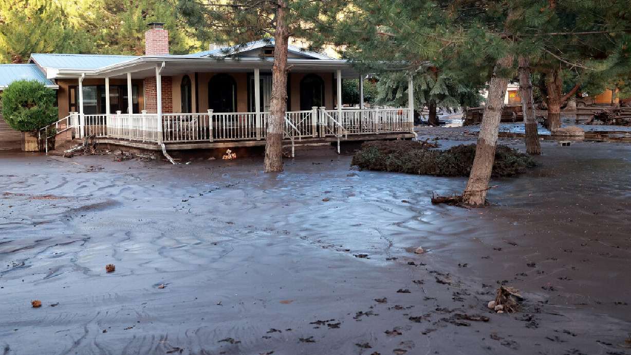 The water line can be seen on a house that is surrounded by mud after flooding in Beaver on July 20.