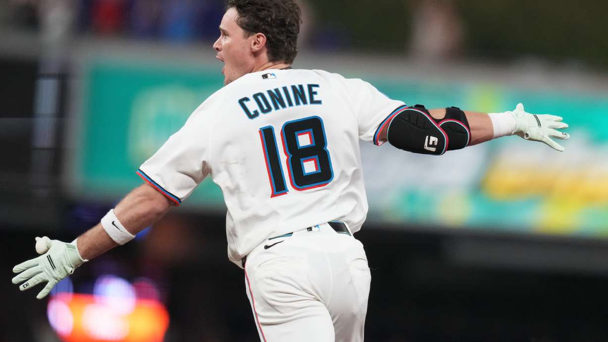 Miami Marlins' Griffin Conine (18) reacts after hitting a walk off single to score Heriberto Hernández and defeat the Philadelphia Phillies in the the ninth inning of a baseball game, Monday, July 27, 2026, in Miami.