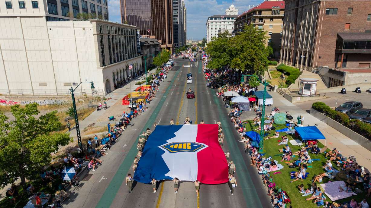 Boy Scouts and adults leaders from Scouting America carry the Utah state flag during the Days of ’47 Parade in Salt Lake City on Friday. Utah was ranked the best state nationwide, according to U.S. News & World Report, but it may not last.