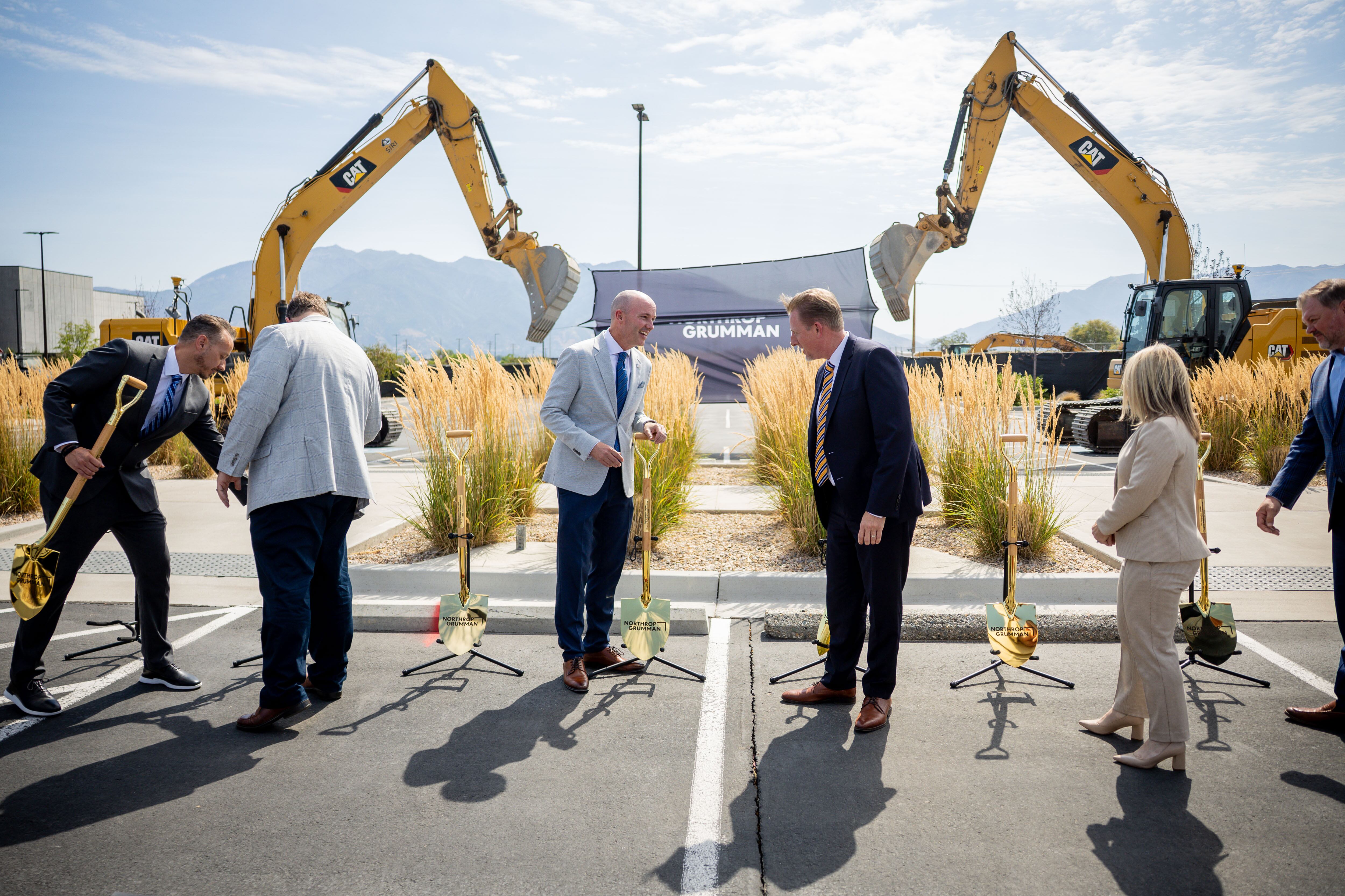 Gov. Spencer Cox, Sarah Willoughby, vice president and general manager of strategic deterrent systems at Northrop Grumman, and Benjamin R. Davies, corporate vice president and president at Northrop Grumman Defense Systems and others with construction machinery during the Roy Innovation Center Legacy Building groundbreaking at the Roy Innovation Center on July 14. Cox called Utah's recognition as the best state nationwide for the fourth year in a row as a testament to what the state represents.