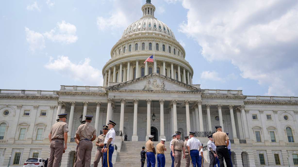 Members of the military stand outside of the Capitol to practice for Sen. Lindsey Graham's funeral, Monday, in Washington. Graham's funeral is set to take place on Tuesday with world leaders in attendance.