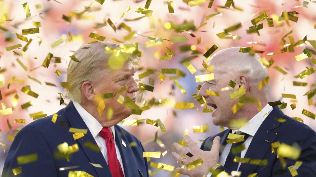 President Donald Trump, left, speaks with FIFA President Gianni Infantino as confetti falls at the conclusion of the World Cup championship final soccer match between Spain and Argentina in East Rutherford, N.J., Sunday, July 19, 2026.
