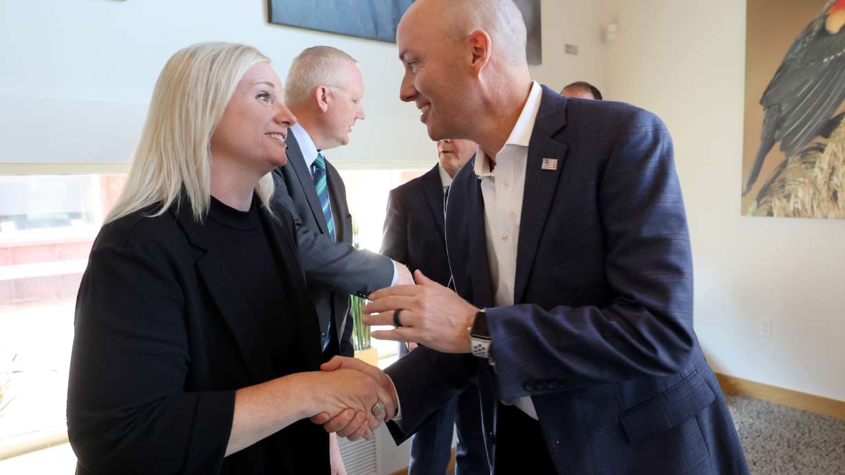Jamie Barnes shakes hands with Utah Gov. Spencer Cox at the Eccles Wildlife Education Center in Farmington on Sept. 3, 2024. Cox named Barnes as the new Utah Department of Natural Resources commissioner on Tuesday.