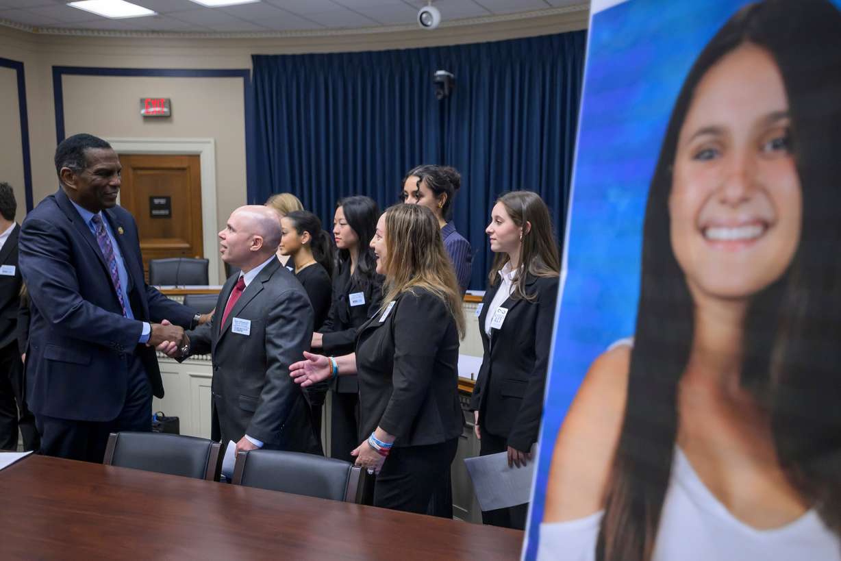 Rep. Burgess Owens, R-Utah, left, talks with Alyssa Alhadeff's parents, Dr. Ilan Alhadeff – COO and Co-Founder, Make Our Schools Safe, center, and Alyssa's Law Author, Lori Alhadeff, CEO and Co-Founder, Make Our Schools Safe, right, prior to a news conference announcing the introduction of "Alyssa's Act" (H.R. 6809), on Capitol Hill, Feb. 10, in Washington.