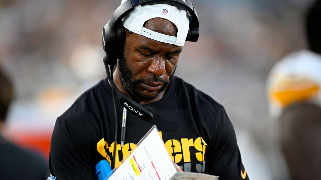 FILE - Then-Pittsburgh Steelers defensive backs coach Gerald Alexander writes down notes on the sideline during the first half of an NFL preseason football game against the Jacksonville Jaguars, Aug. 9, 2025, in Jacksonville, Fla.