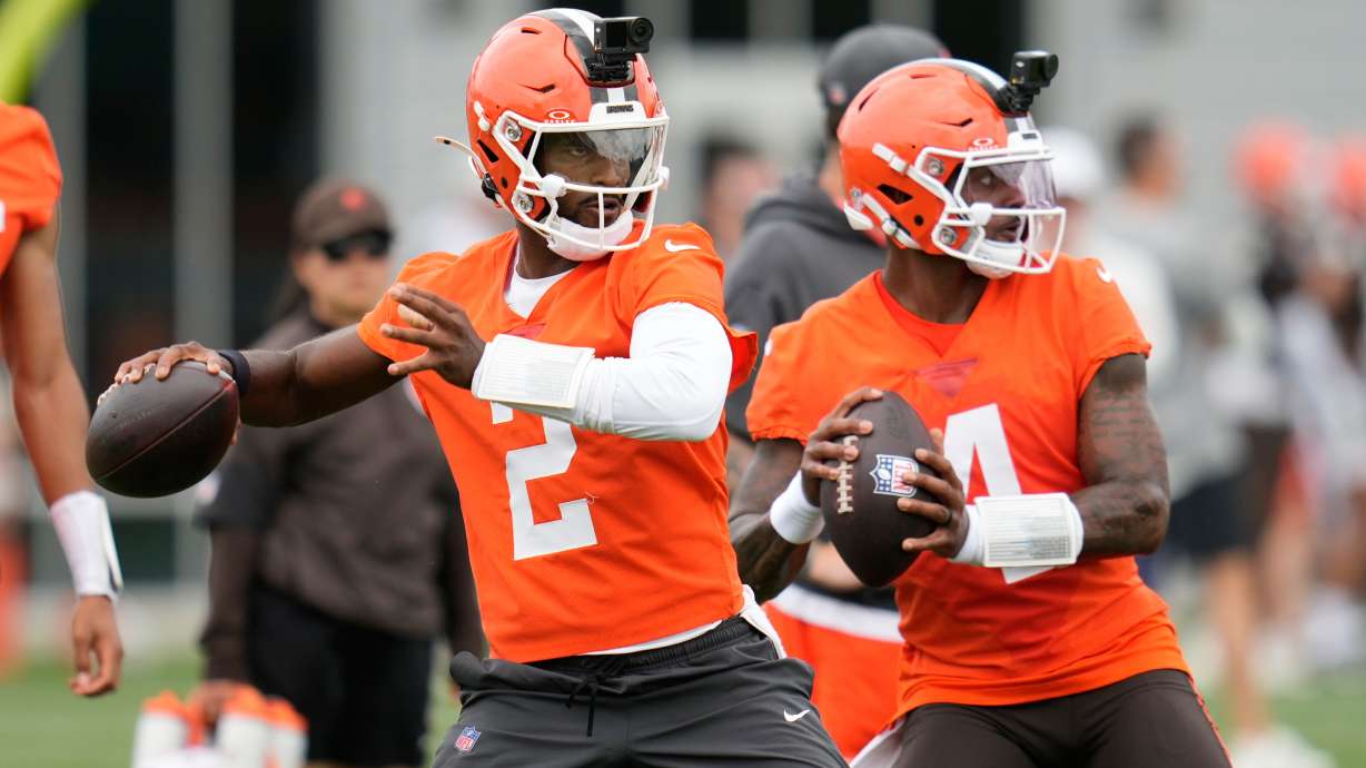FILE - Cleveland Browns quarterbacks Shedeur Sanders, left, and Deshaun Watson, right, throw during the teams' NFL football practice, Tuesday, June 9, 2026, in Berea, Ohio.