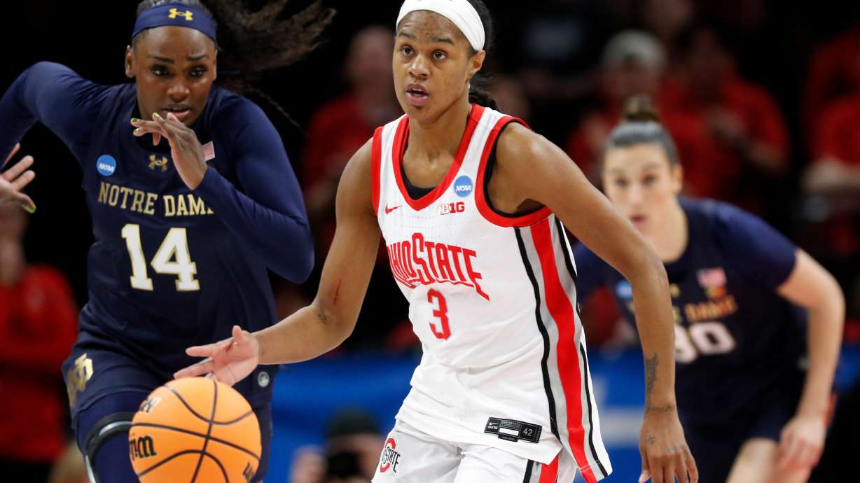 FILE - Ohio State guard Kennedy Cambridge (3) brings the ball downcourt past Notre Dame guard KK Bransford (14) during the first half in the second round of the NCAA college basketball tournament, March 23, 2026, in Columbus, Ohio.