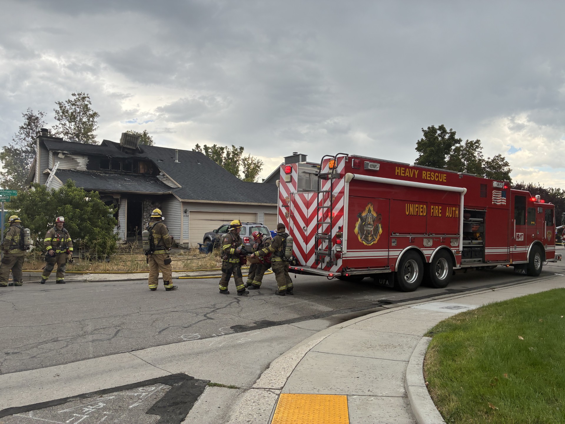 A home in West Jordan is pictured after it caught fire on Tuesday.