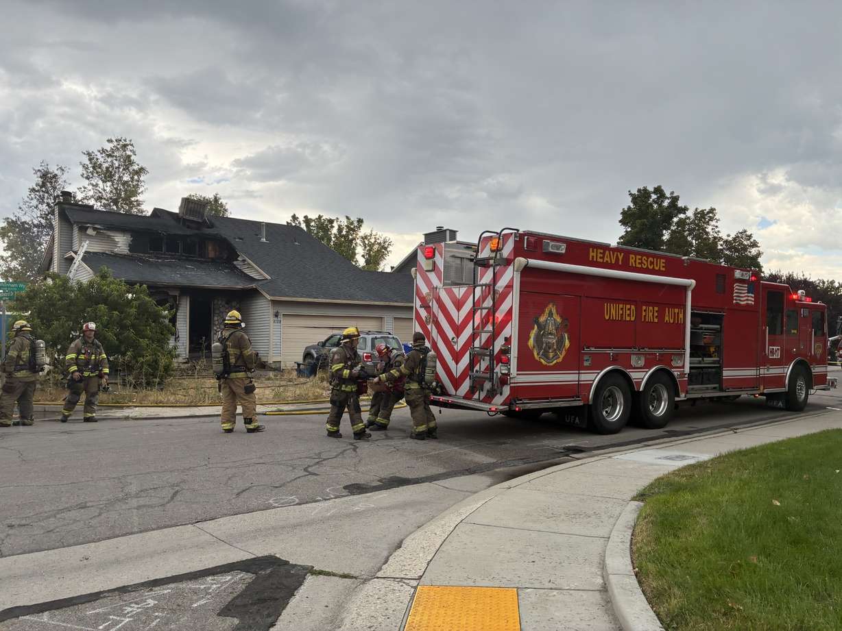 A home in West Jordan is pictured after it caught fire on Tuesday.