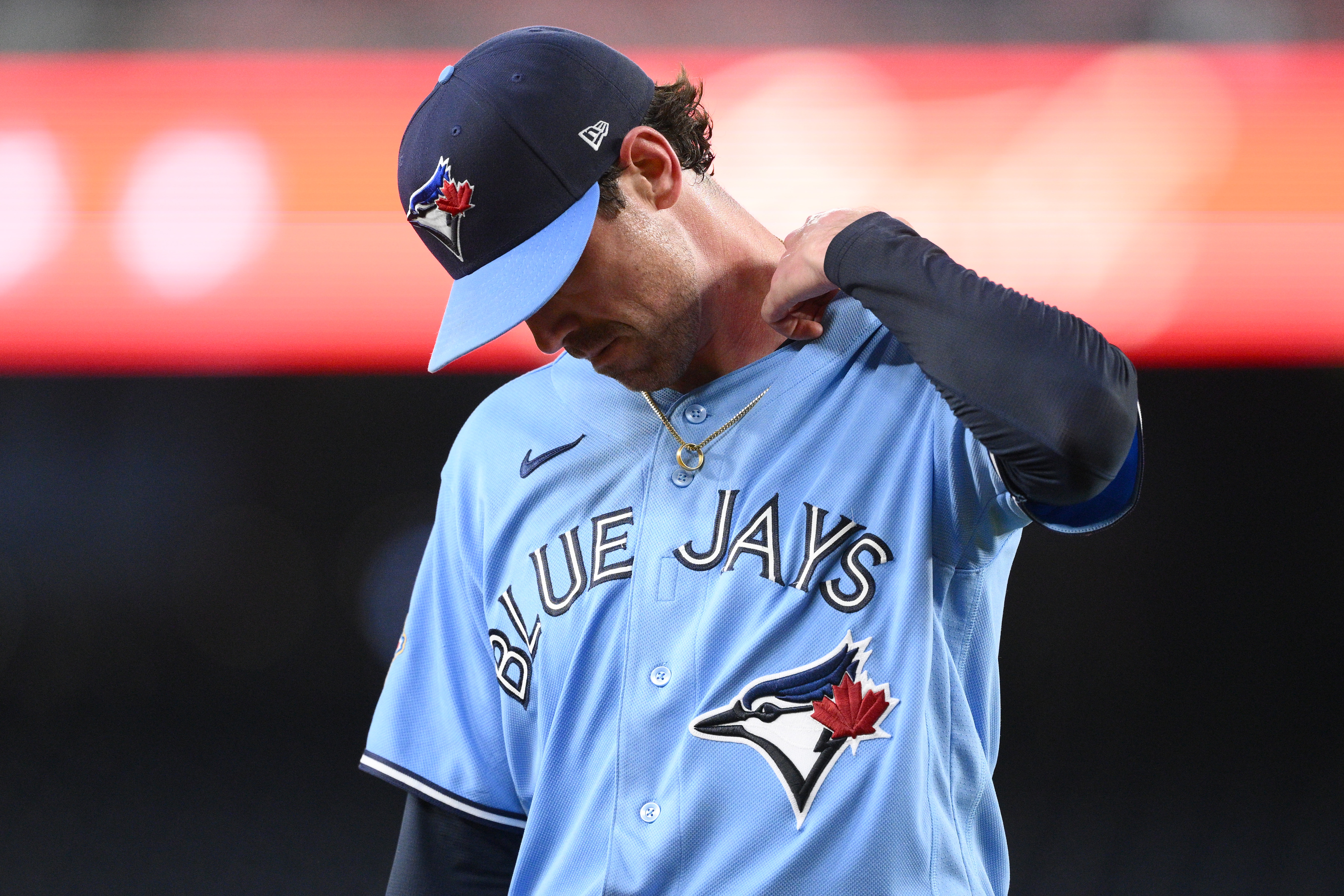 Toronto Blue Jays pitcher Shane Bieber walks back to the dugout after he was pulled from a baseball game in the first inning against the Washington Nationals, Tuesday, July 28, 2026, in Washington. 