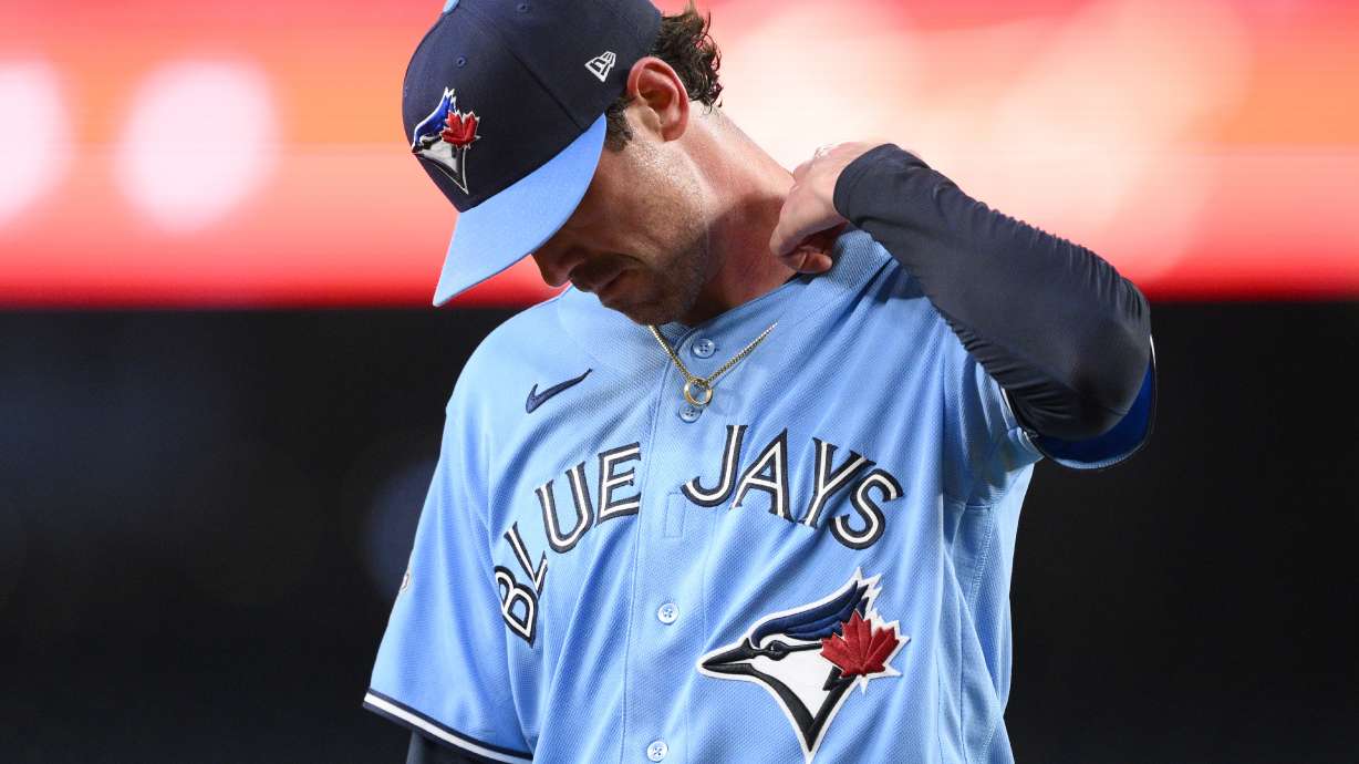Toronto Blue Jays pitcher Shane Bieber walks back to the dugout after he was pulled from a baseball game in the first inning against the Washington Nationals, Tuesday, July 28, 2026, in Washington.