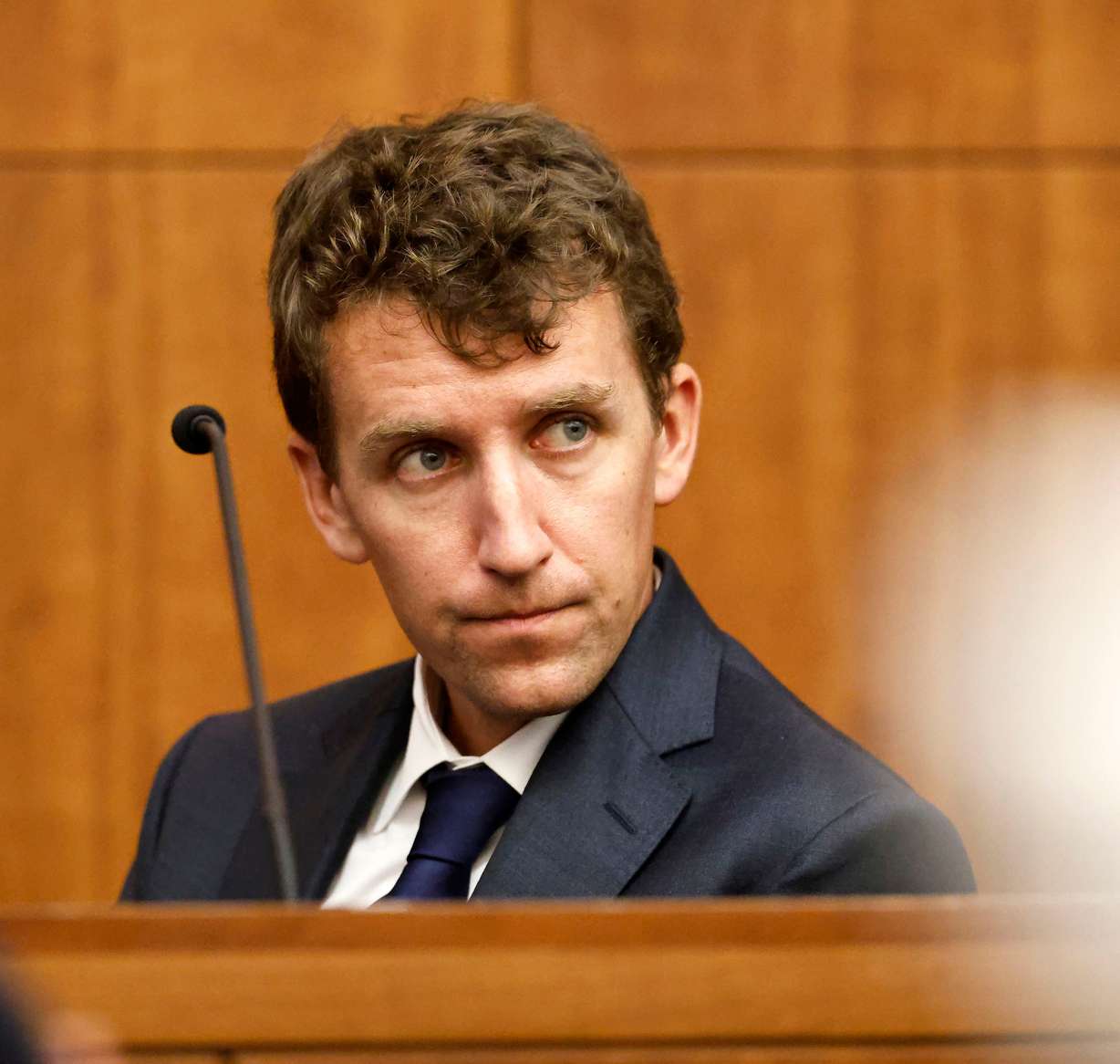 Patrick Clancy glances over at the defense table and his ex wife Lindsay Clancy is seated during her murder trial at the Plymouth Superior Court in Plymouth, Mass., Monday.