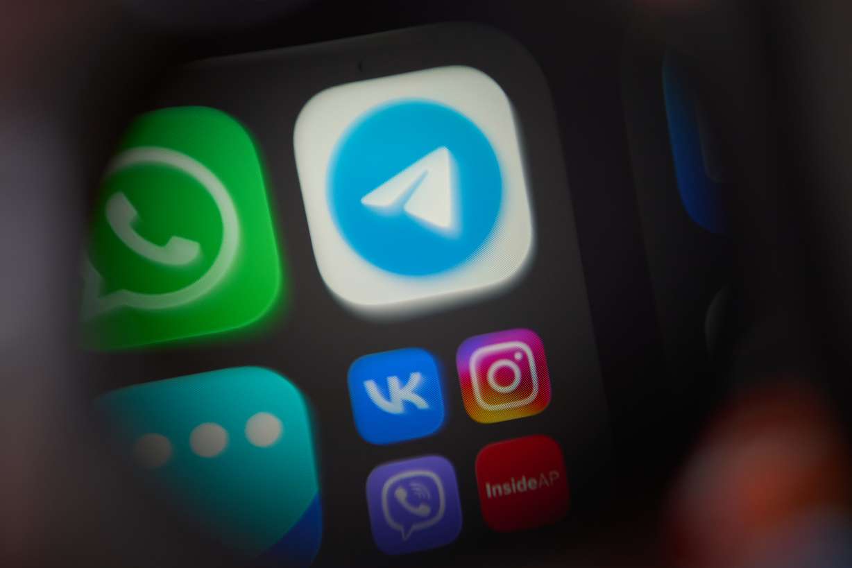 The app Telegram, a popular messenger app in Russia restricted by authorities, is shown on a smartphone in Moscow, Wednesday. App cofounder Pavel Durov was charged with aiding terrorism.