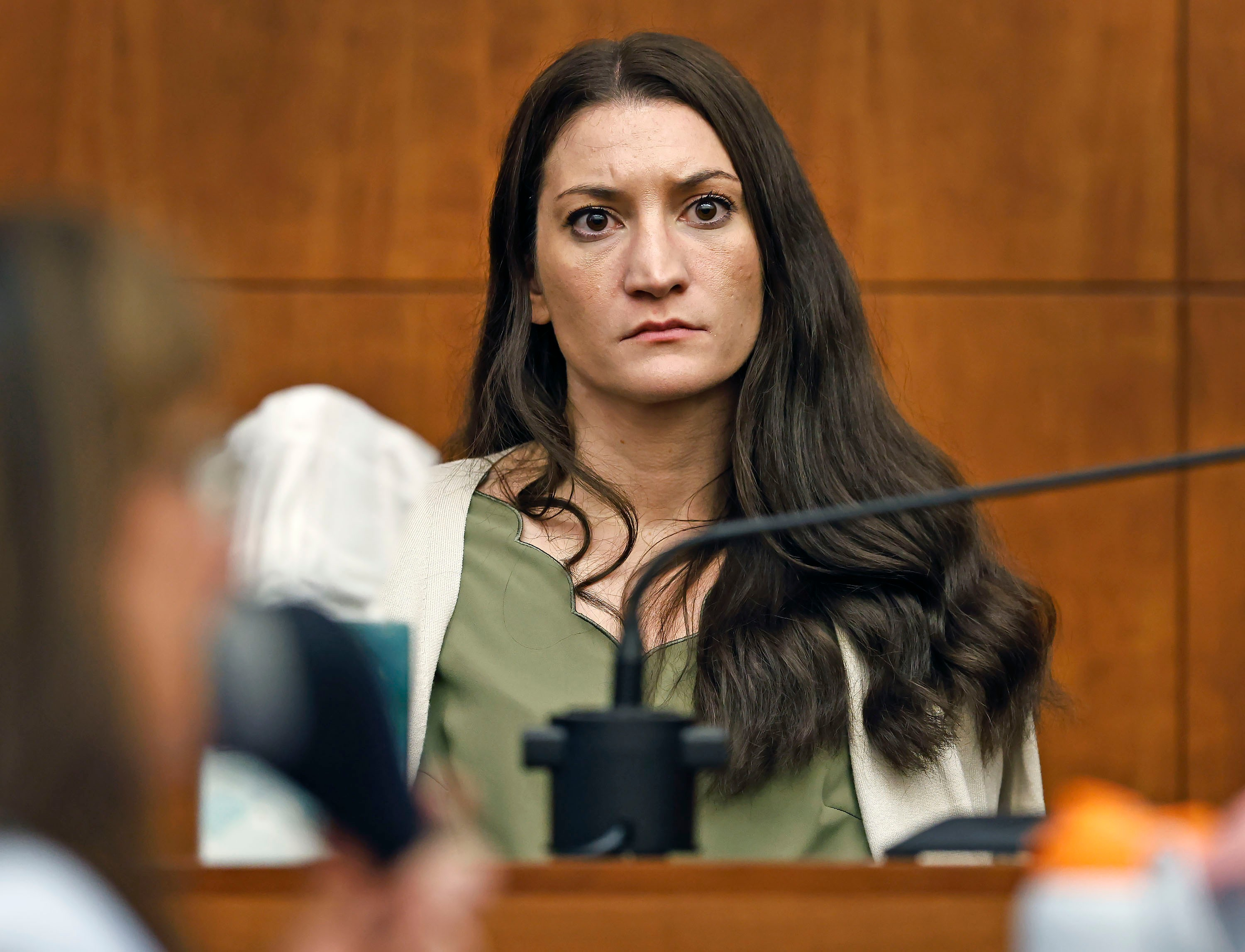 Lindsay Clancy waits for the judge to call a prospective jury member into court in her murder trial where she is charged in the 2023 killing of her three children, Wednesday, in Plymouth Superior Court in Plymouth, Mass.