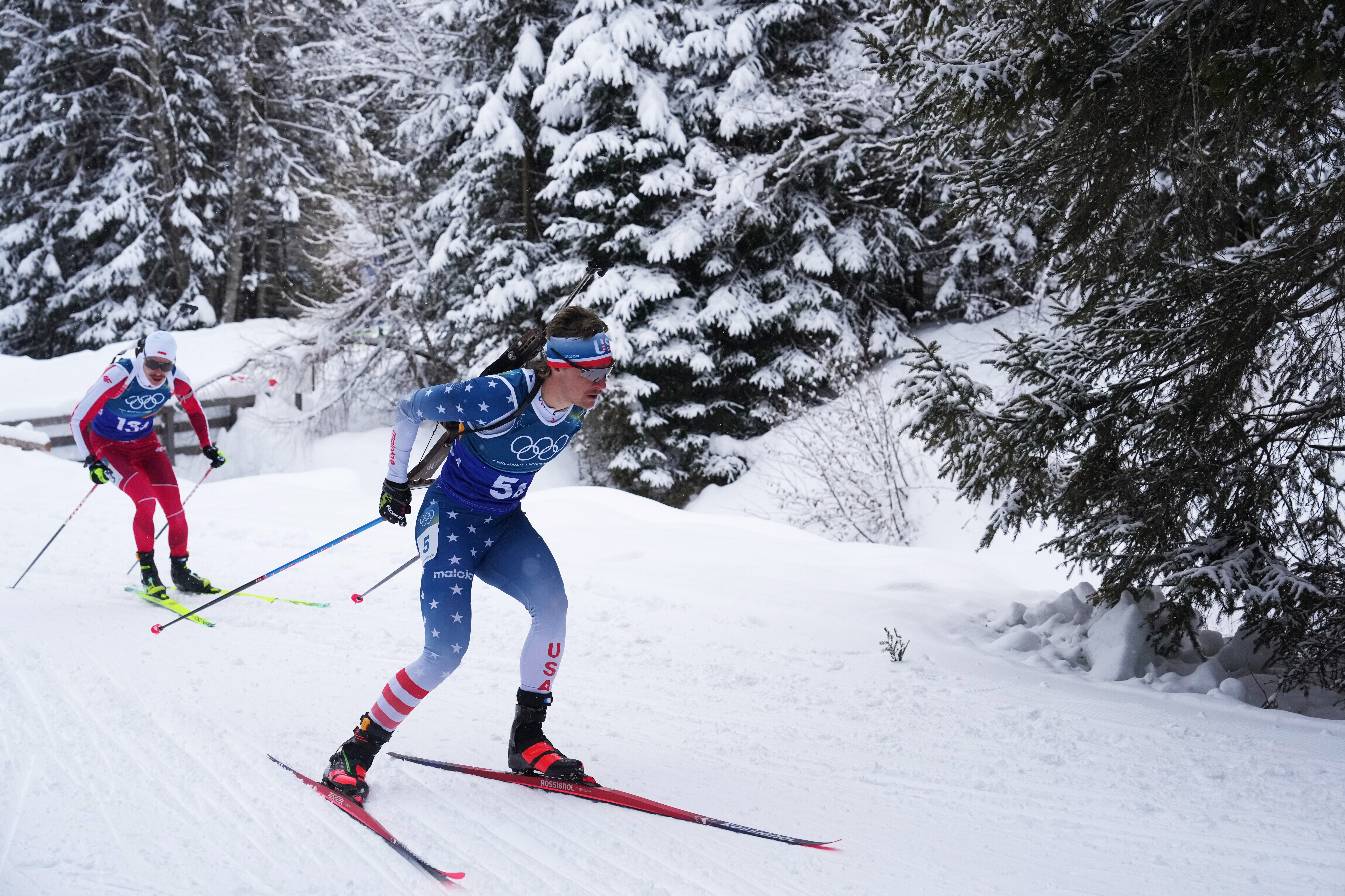 FILE - Campbell Wright, of the United States, right, competes in the men's 4x7.5-kilometer relay biathlon race at the 2026 Winter Olympics in Anterselva, Italy, Feb. 17, 2026. 