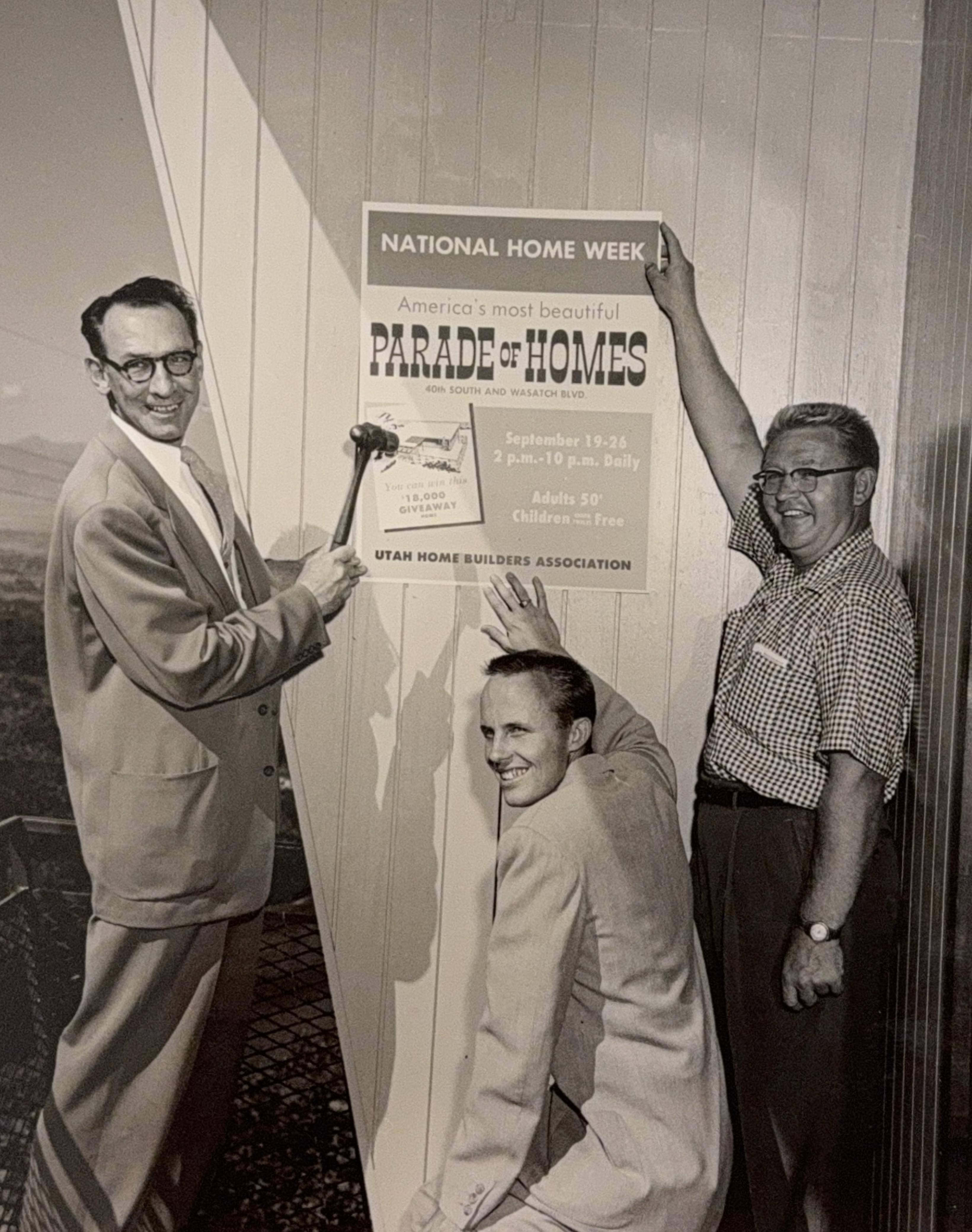 Builders install a Parade of Homes sign during the 1954 Salt Lake Parade of Homes. The 1954 event is the earliest Parade of Homes extensively documented by the Salt Lake Home Builders Association.