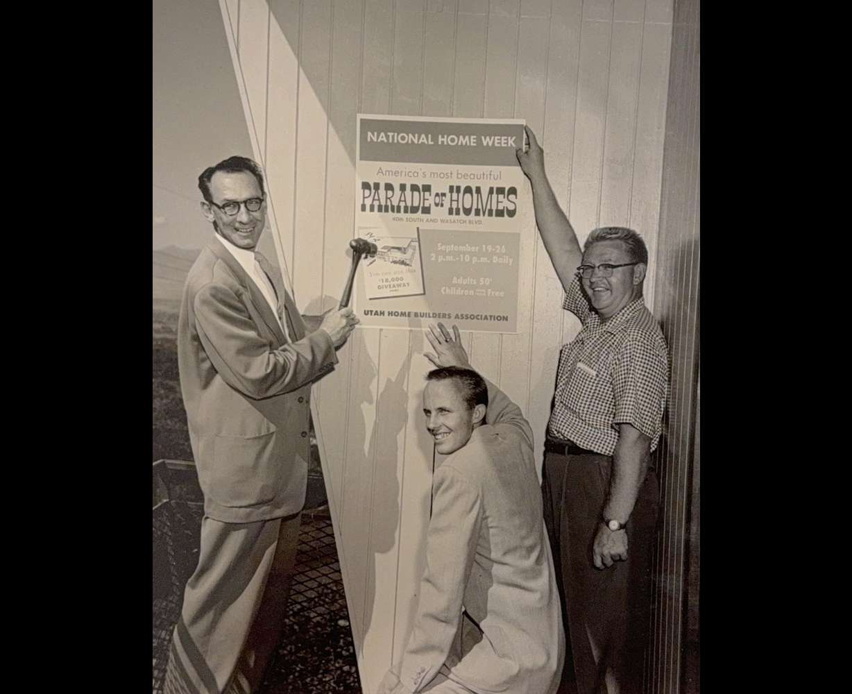 Builders install a Parade of Homes sign during the 1954 Salt Lake Parade of Homes. The 1954 event is the earliest Parade of Homes extensively documented by the Salt Lake Home Builders Association.
