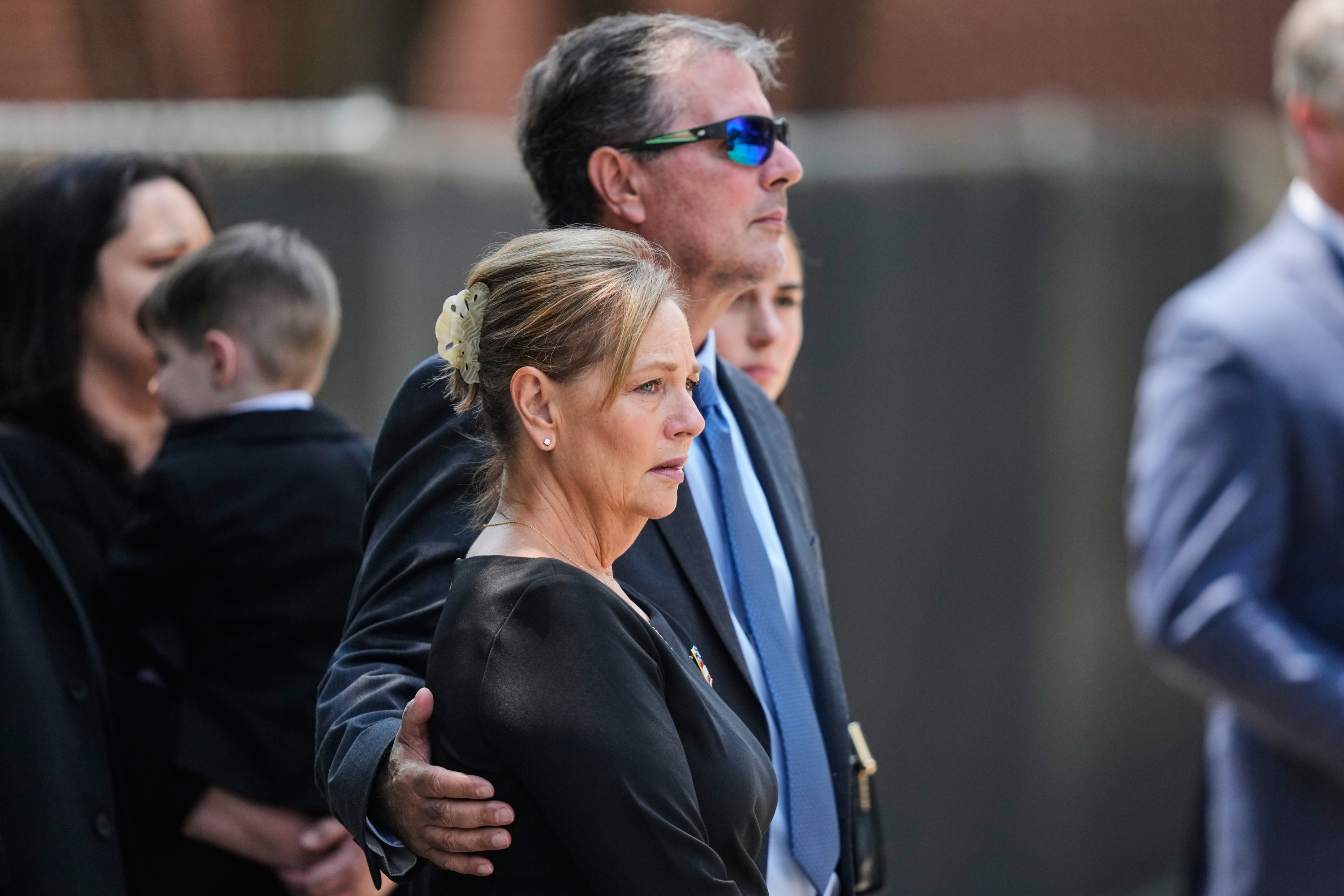 Sen. Darline Graham, R-S.C., the sister of the late Sen. Lindsey Graham, R-S.C., as her brother's casket is carried out of First Baptist Church in Columbia, S.C., following a funeral service, Wednesday. Many of the speakers praised Darline Graham in their speeches at the funeral.