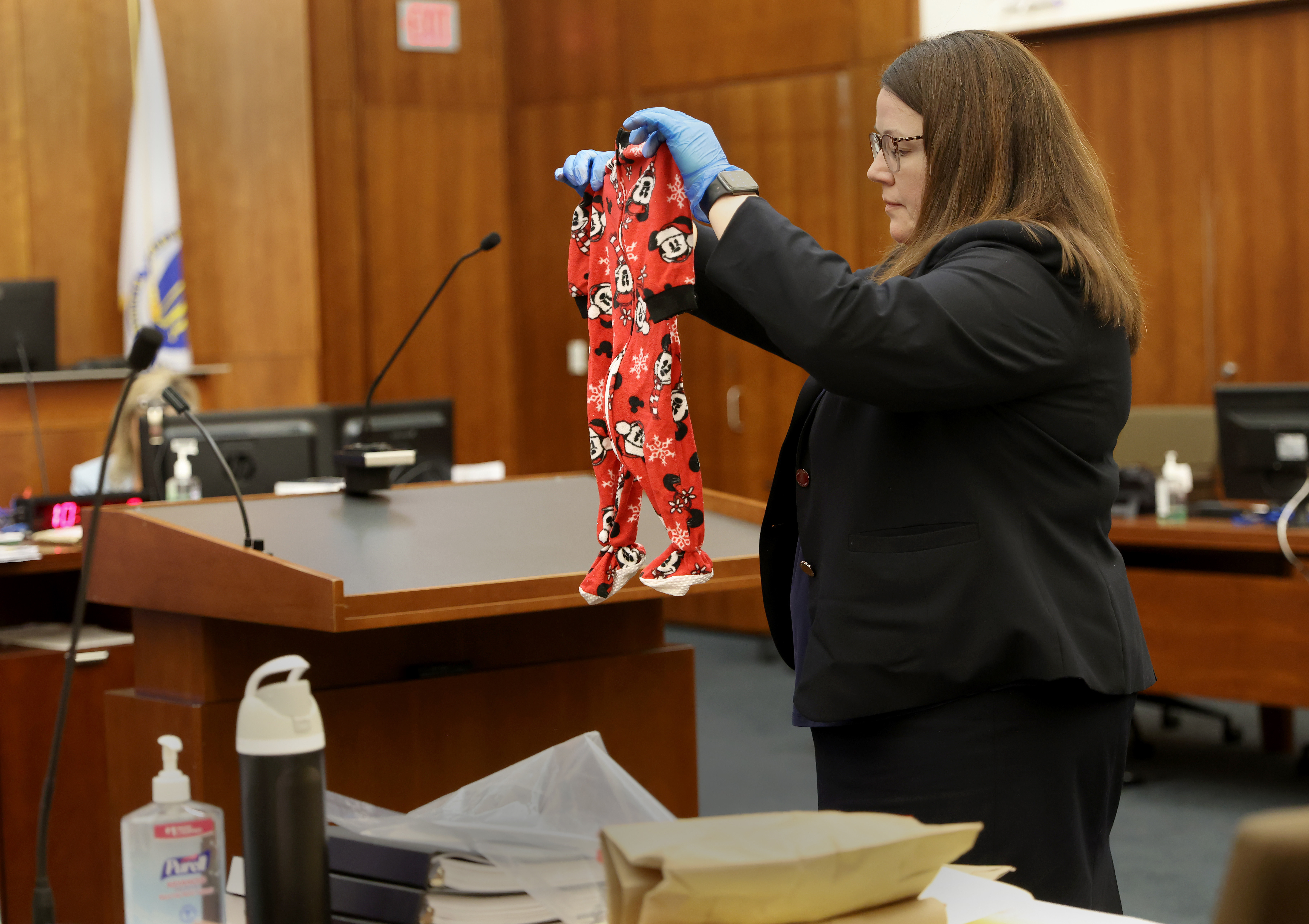Assistant District Attorney Jennifer Sprague holds up as evidence the pajamas of Callan Clancy during the Lindsay Clancy murder trial at Plymouth Superior Court in Plymouth, Mass., on Wednesday.
