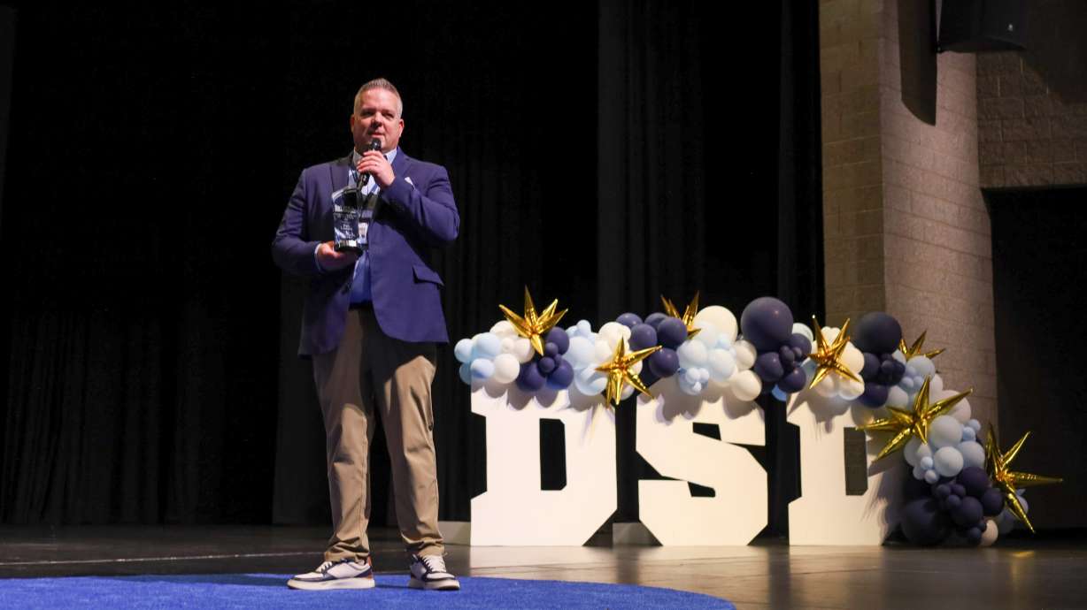 Davis School District Superintendent Dan Linford with his Superintendent of the Year award on Wednesday at Syracuse High School. Linford was presented with the award during a conference.