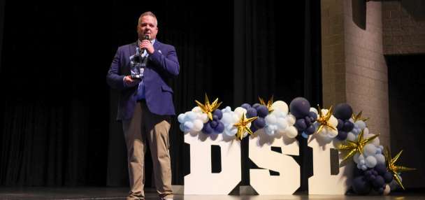 Keynote speaker surprised with Superintendent of the Year award