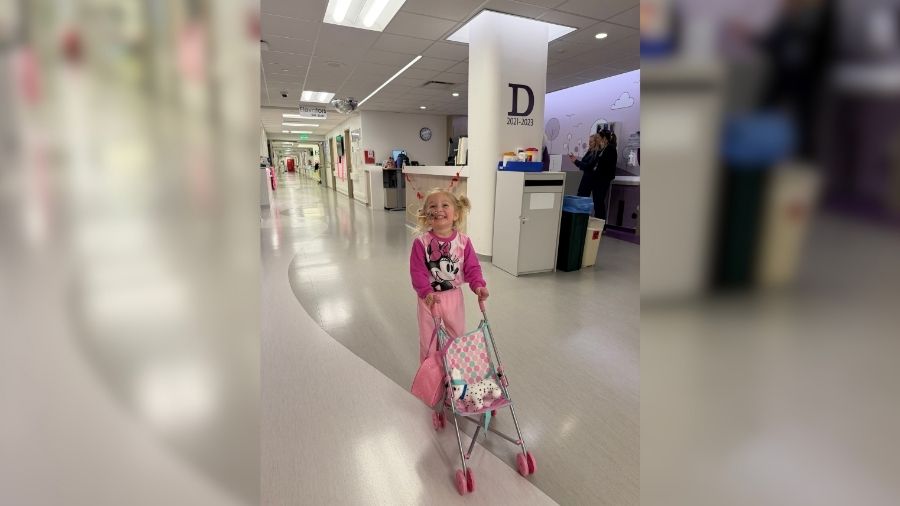 Three-year-old Estelle Santiago walks with a stroller at Primary Children's Hospital in this January photo. She was hospitalized with hemolytic uremic syndrome.