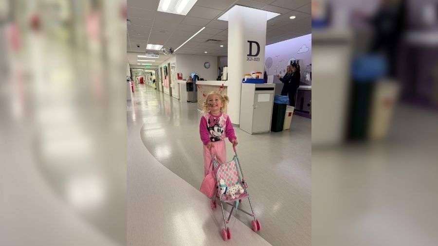 Three-year-old Estelle Santiago walks with a stroller at Primary Children's Hospital in this January photo. She was hospitalized with hemolytic uremic syndrome.