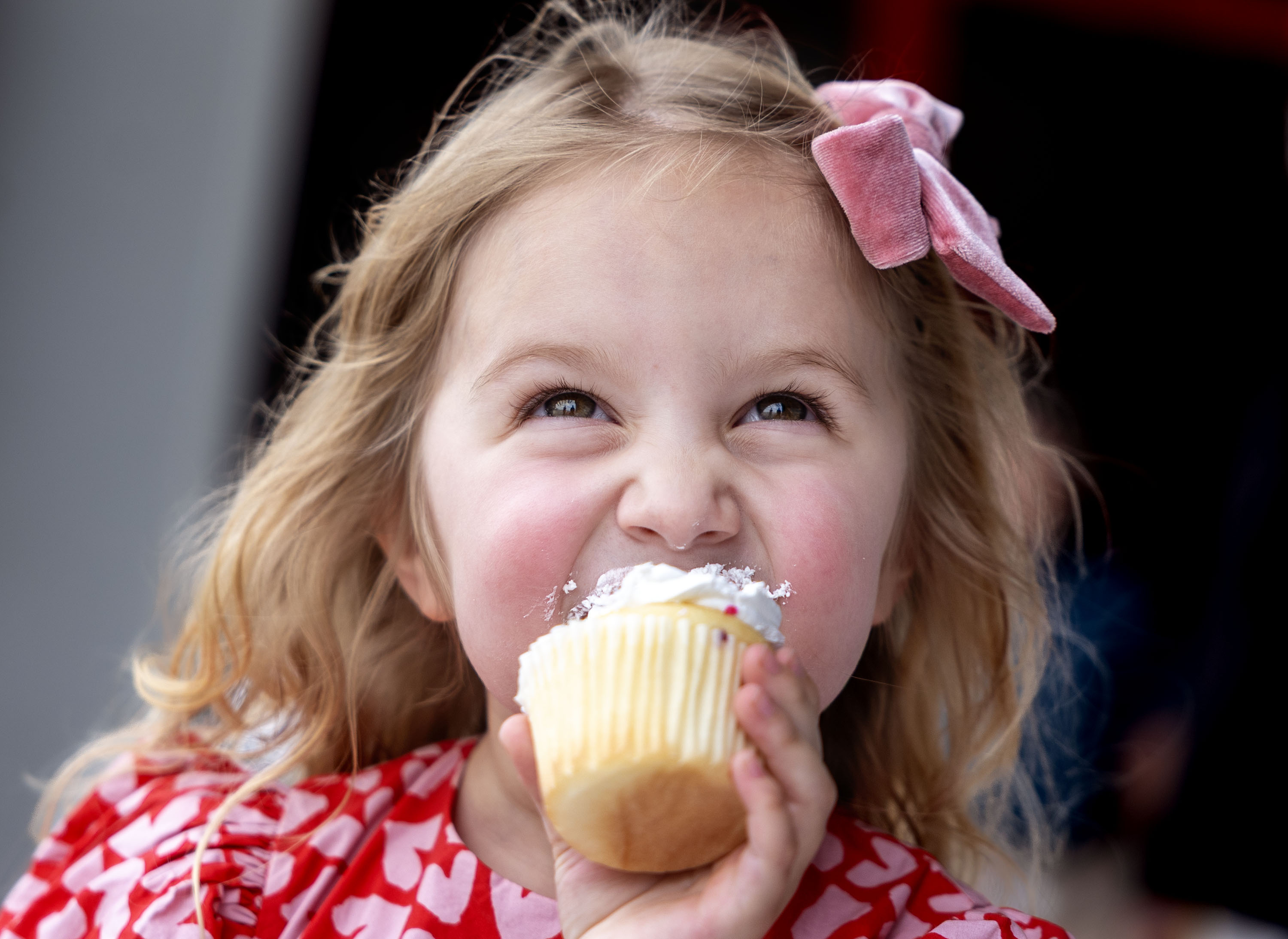 Estelle Santiago eats a cupcake at the Intermountain Health Flight & Ambulance Hangar in Salt Lake City on Wednesday.